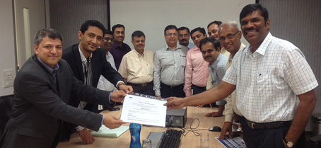 Sankaran Venkataramani, Associate Director, KPMG, presents the certificate for Defiance's successful compliance to CMMI Level 3 to Subu D Subramanian, MD & CEO, Defiance Technologies 