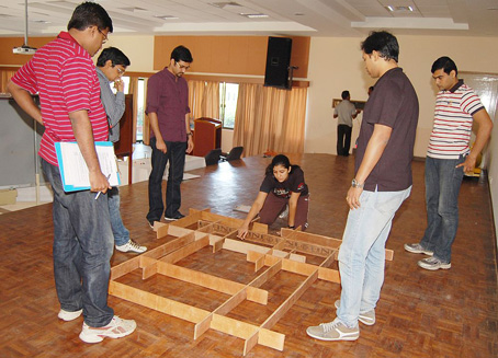 HLP associates work together in a team-building exercise at the leadership development programme HLP associates work together in a team-building exercise at the leadership development programme